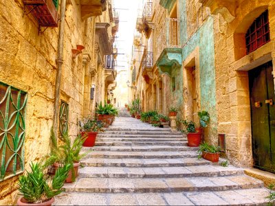 Typical narrow street with stairs in the city Valetta on the island of Malta, Europe