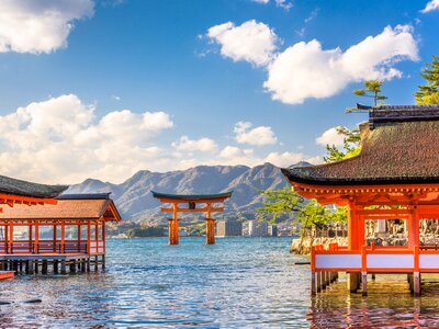 Itsukushima Jinja Miyajima floating shrine on body of water in lake, Hiroshima, Japan