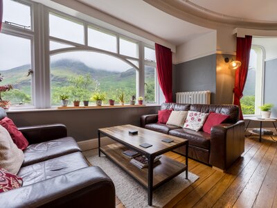 Leather sofas and coffee table at Hassness House lounge room with Buttermere window views