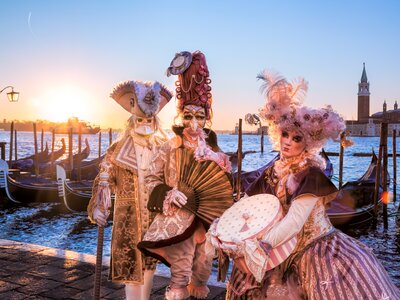 Carnevale in Venice, famous carnival in Venice, Italy with people in masquerade costumes along the canals