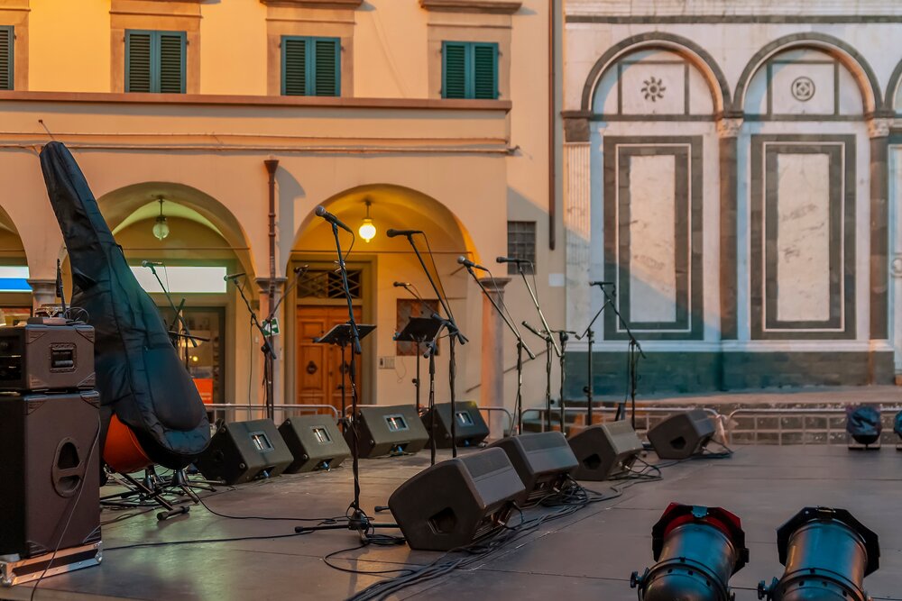 Italy festivals -- A stage is set up to host an outdoor musical concert, in the central square of Empoli, Florence, Italy