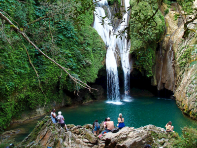 Gran Parque Natural Topes de Collantes, large waterfall crashing into turquoise water, Cuba