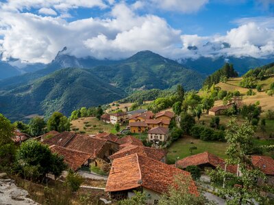 Village nestled in green mountainous landscape, Toranzo, Cantabria, Spain