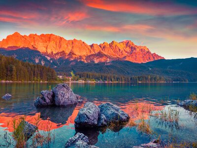 Colourful sunset on  Zugspitze mountain viewed from Eibsee lake