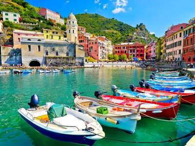 Colourful buildings and boats at port seaside of Vernazza village in summer in the Cinque Terre area, Italy