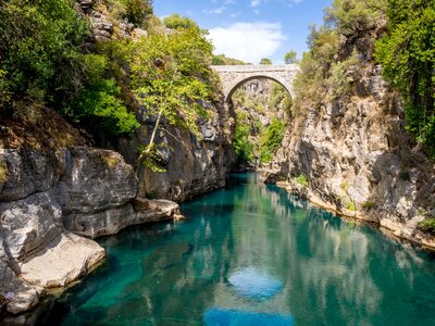 Arch bridge over turquoise-coloured Koprucay river, Koprulu National Park, Turkey