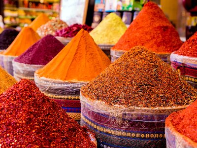 Turkish bazaar showcasing variety of colourful spices stacked as separate mounds, Turkey