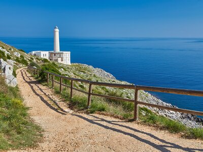 White lighthouse cliff overlook seascape daytime Punta Palascia Otranto Salento Italy