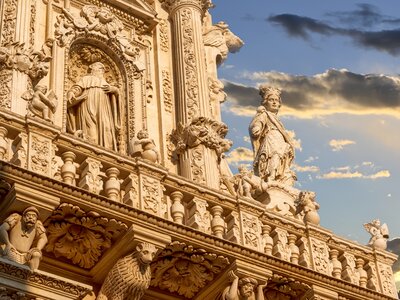 Church of Santa Croce Lecce baroque facade detail illuminated by the warm sunlight, Lecce, Puglia, Italy