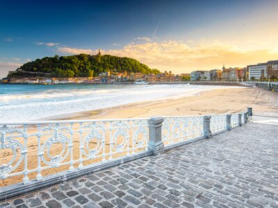 Nice beach in the morning with the old town of San Sebastian, Spain