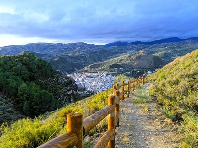 Hiking trail overlooking Quéntar white village, Sierra Nevada mountains, Granada, Andalusia, Spain