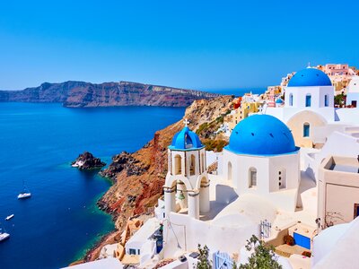 Classic whitewashed walls and blue domes of houses on Santorini, Greece