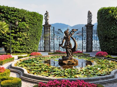 Garden with fountains, statues, flower beds, Villa Carlotta, Lake Como, Italy