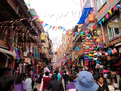 Busy street with colourful bunting-decorations overhead, Thamel, Kathmandu, Nepal