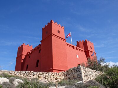 The red tower also known as St Agatha’s Tower with flag of Switzerland on top, Malta