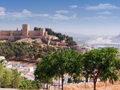 Distant view of castle fortress Real Colegiata de Santa Maria La Mayor, Antequera, Malaga Province, Andalucia, Spain